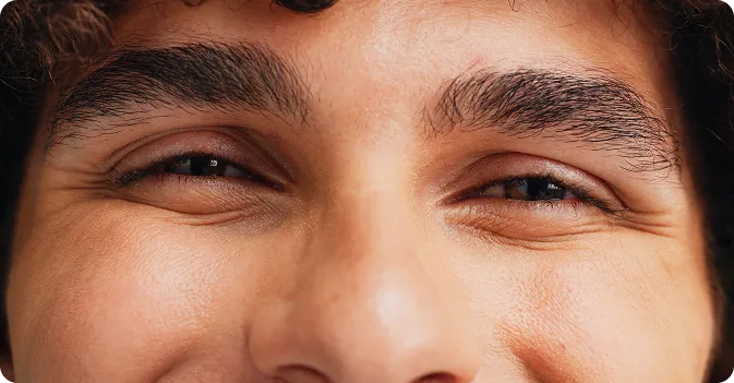 Close-up of a man's full, well-defined eyebrows